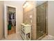 Nicely appointed bathroom with shower, vanity, and convenient access to a walk-in closet at 1047 Honeybee Trl, Fort Mill, SC 29715