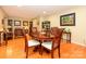 Dining room with hardwood floors and a large window for natural light at 1047 Honeybee Trl, Fort Mill, SC 29715