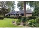 Charming ranch-style home featuring a well-manicured lawn and mature landscaping at 1047 Honeybee Trl, Fort Mill, SC 29715