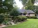 A charming home with beautiful landscaping and a well-maintained lawn at 1047 Honeybee Trl, Fort Mill, SC 29715