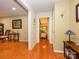 Hallway with hardwood floors that connects to the dining room and living room at 1047 Honeybee Trl, Fort Mill, SC 29715