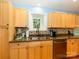 Updated kitchen with stainless steel appliances, granite countertops, mosaic backsplash and hardwood floors at 1047 Honeybee Trl, Fort Mill, SC 29715
