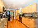 Well-equipped kitchen features hardwood floors, ample counter space, modern appliances, and a stylish backsplash at 1047 Honeybee Trl, Fort Mill, SC 29715