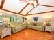Spacious living room featuring hardwood floors and dual reclining sofas at 1047 Honeybee Trl, Fort Mill, SC 29715
