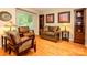 Cozy living room showcases comfortable seating, hardwood floors, and natural light, creating a relaxing atmosphere at 1047 Honeybee Trl, Fort Mill, SC 29715