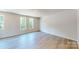 Spacious bedroom with beautiful hardwood floors, and plenty of sunlight from the three windows at 11017 Warfield Ave # 4, Huntersville, NC 28078