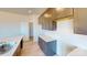 Stylish kitchen featuring dark cabinets, quartz countertops, stainless steel sink, and open pantry at 11017 Warfield Ave # 4, Huntersville, NC 28078