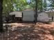 View of backyard with multiple storage sheds at 111/113 Shawnee Trl # D140/141, Mount Gilead, NC 27306