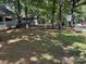 View of the backyard surrounded by mature trees and greenery at 111/113 Shawnee Trl # D140/141, Mount Gilead, NC 27306