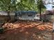Backyard view with wooden fencing at 111/113 Shawnee Trl # D140/141, Mount Gilead, NC 27306
