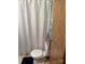 A well-lit bathroom features a shower with a white curtain and white toilet at 111/113 Shawnee Trl # D140/141, Mount Gilead, NC 27306