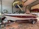 The boat on a trailer parked in the shed at 111/113 Shawnee Trl # D140/141, Mount Gilead, NC 27306