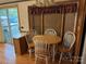 Dining room with circular table, 4 chairs, and sliding door at 111/113 Shawnee Trl # D140/141, Mount Gilead, NC 27306