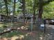 View of home with a well maintained yard and mature trees at 111/113 Shawnee Trl # D140/141, Mount Gilead, NC 27306
