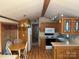 Kitchen features wood cabinets, full sized fridge and dining table at 111/113 Shawnee Trl # D140/141, Mount Gilead, NC 27306