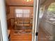 Living room view featuring a tan sofa and patterned rug, as seen from the porch door at 111/113 Shawnee Trl # D140/141, Mount Gilead, NC 27306