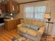 Living room with love seat, blue pillows, lamp and window at 111/113 Shawnee Trl # D140/141, Mount Gilead, NC 27306