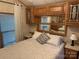 Bright main bedroom featuring overhead storage and side tables at 111/113 Shawnee Trl # D140/141, Mount Gilead, NC 27306
