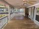 Covered porch with 3 ceiling fans, access to multiple rooms, and views of the neighborhood at 111/113 Shawnee Trl # D140/141, Mount Gilead, NC 27306