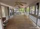 Long covered porch with wood flooring, white railings, and access to multiple rooms at 111/113 Shawnee Trl # D140/141, Mount Gilead, NC 27306