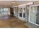 A covered porch with 3 ceiling fans, an exterior door, and views of the neighborhood at 111/113 Shawnee Trl # D140/141, Mount Gilead, NC 27306