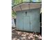 View of backyard shed with white trim and bluish-green siding at 111/113 Shawnee Trl # D140/141, Mount Gilead, NC 27306