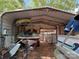 View of a covered storage area with boat, trailer and other equipment at 111/113 Shawnee Trl # D140/141, Mount Gilead, NC 27306