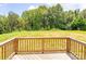Wooden deck providing outdoor views of the lush backyard landscaping at 1542 Antioch Dr, Conover, NC 28613
