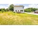 Large backyard with an expansive lawn and a small deck, perfect for entertaining at 1542 Antioch Dr, Conover, NC 28613