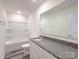 Bright bathroom featuring a shower-tub, granite counters, and contemporary finishes at 1542 Antioch Dr, Conover, NC 28613