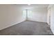 Bright bedroom features new carpet, neutral walls, and a double window at 1542 Antioch Dr, Conover, NC 28613