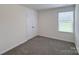 Clean bedroom featuring new carpet, neutral walls, and a closet at 1542 Antioch Dr, Conover, NC 28613