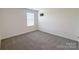 Comfortable bedroom featuring new carpet, neutral walls, and a TV mount at 1542 Antioch Dr, Conover, NC 28613