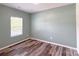 Bedroom featuring hardwood flooring, a neutral paint color, and a bright window at 1542 Antioch Dr, Conover, NC 28613