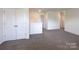 Large bonus room boasts new carpet, white trim, and neutral walls at 1542 Antioch Dr, Conover, NC 28613