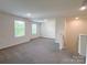 Spacious bonus room features neutral carpet, bright windows, and recessed lighting at 1542 Antioch Dr, Conover, NC 28613