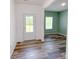 Entryway with stylish wood-look flooring and views of the adjacent room at 1542 Antioch Dr, Conover, NC 28613
