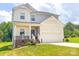 Charming two-story home with a front porch, attached garage and well-manicured lawn at 1542 Antioch Dr, Conover, NC 28613