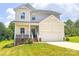 Charming two-story home with a well-manicured lawn and attached two-car garage at 1542 Antioch Dr, Conover, NC 28613