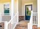 A covered front porch with brick accents and a black front door provides a welcoming entrance at 1542 Antioch Dr, Conover, NC 28613