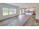 Spacious living room with a view of the kitchen and a wall of windows for natural light at 1542 Antioch Dr, Conover, NC 28613