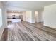 Open-concept living space flowing seamlessly into the kitchen with modern flooring at 1542 Antioch Dr, Conover, NC 28613