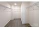 Large walk-in closet featuring carpet flooring and wire shelving at 1542 Antioch Dr, Conover, NC 28613