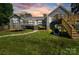 Expansive backyard with playset, trampoline, and lush lawn perfect for Gathering fun at 1774 Timmons Marie Ln, Lincolnton, NC 28092