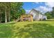 Spacious backyard with a deck and slide, perfect for outdoor fun and entertainment at 1774 Timmons Marie Ln, Lincolnton, NC 28092