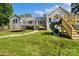 Expansive backyard with playset, trampoline, and lush lawn perfect for Gathering fun at 1774 Timmons Marie Ln, Lincolnton, NC 28092