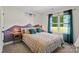 A cozy bedroom with mountain-themed decorations and plenty of natural light at 1774 Timmons Marie Ln, Lincolnton, NC 28092