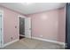Bedroom features pink walls and carpet at 1774 Timmons Marie Ln, Lincolnton, NC 28092