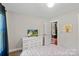 Bright bedroom features an open doorway with a glimpse into another room at 1774 Timmons Marie Ln, Lincolnton, NC 28092