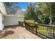 Spacious deck with wood railing overlooks lush greenery, ideal for outdoor entertaining at 1774 Timmons Marie Ln, Lincolnton, NC 28092